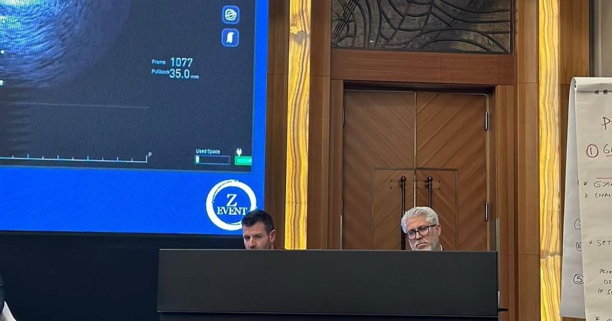 Prof. Dr. Hakan Uçar and Sean Gallagher at the Optima PCI Istanbul 2025 session desk
