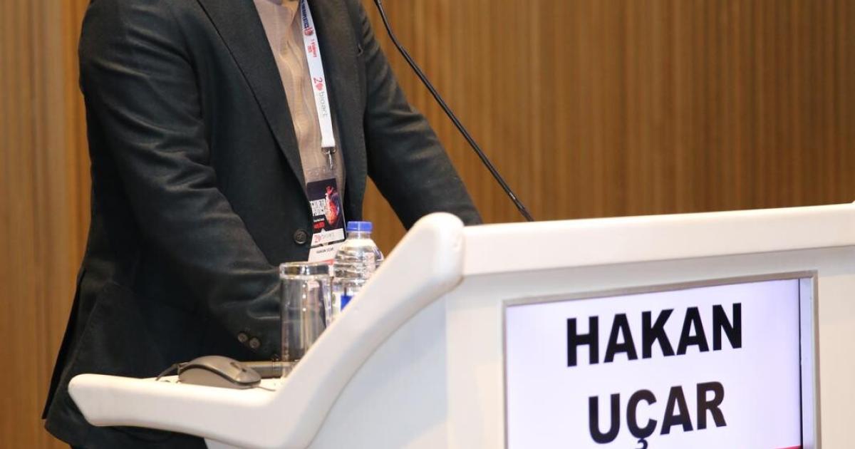 Prof. Dr. Hakan Uçar speaking at the ITT 2025 podium, Crowne Plaza Florya