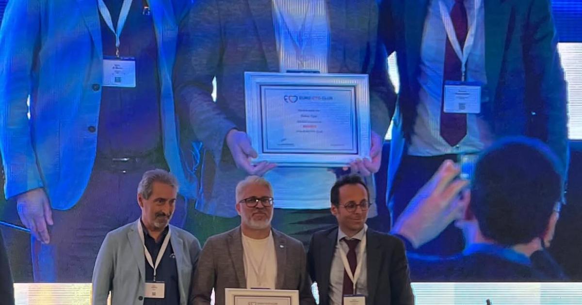 Prof. Dr. Hakan Uçar with a plaque on the Euro CTO 2024 stage, CVK Park Bosphorus Hotel